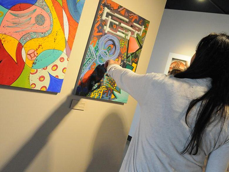 community members pointing at artwork that is part of the penn state lehigh valley collection