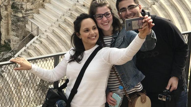 three students taking a selfie at the Acropolis